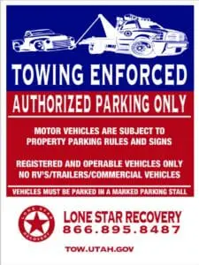 A poster of a towing enforcement sign.